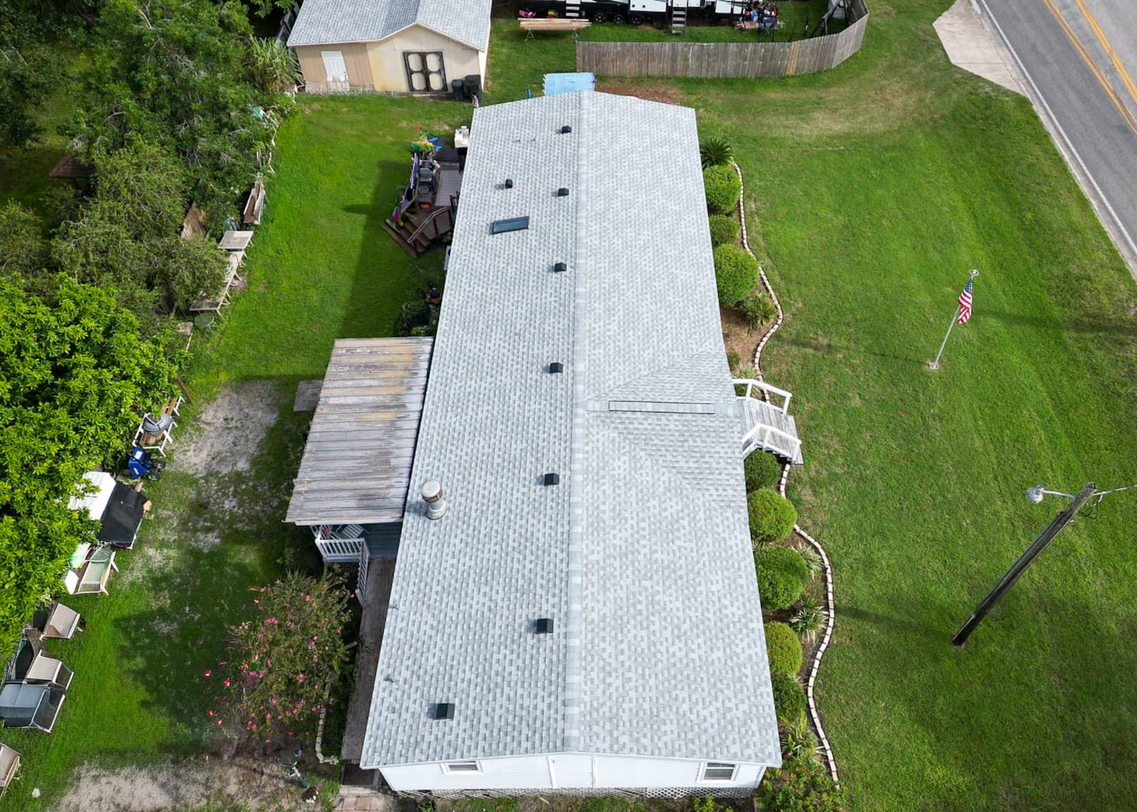 Aerial view of a shingle roof repair by Atlantic Surf Roofing in Palm Coast, FL