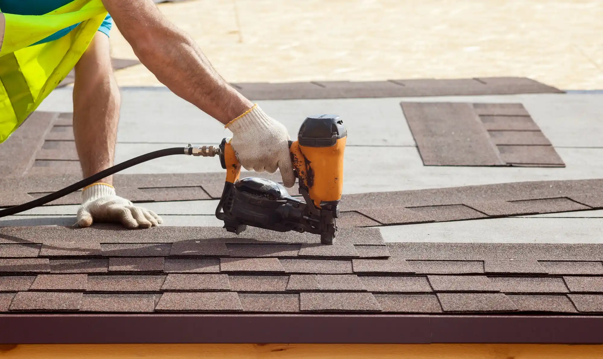 Palm Coast roofing contractor installing shingles
